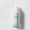 Serum bottle under a swipe of serum