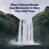 Waterfall over mossy cliffs, silver history text graphic