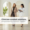 Two women in a bright hallway with clinician-curated solutions message