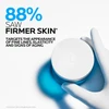 Gloved hand holding an open Hyalu B5 jar with firmer skin result callout
