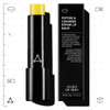 Lip balm stick beside its black box