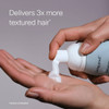 Foam dispensed into a palm, delivers 3x more textured hair
