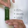Hand holding a FODZYME stick pack with three feature callouts