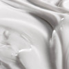 Close-up swirl of pure grace firming body emulsion texture