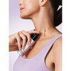 Woman applying lift and firm serum lines on neck