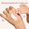 Hand blending sunscreen on skin with no white cast