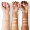 Skin Glow Stick Champagne Rose Cognac swatches on three arm tones