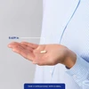 Hand holding a 0.629 inch capsule, take 1 capsule daily with a meal
