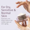 Hand holding open epionce Renewal Facial Cream jar with dry and sensitive skin text