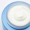 Open jar of rich white night cream