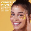 Smiling woman wearing gold under-eye patches, clinically proven after 1 use text