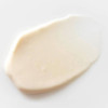 Smear of cream-colored lotion texture