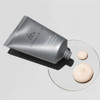 Rescue tube lying beside dabs of balm on a glass dish