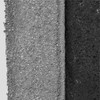 Close-up of gray and charcoal black Superfoliant powder textures