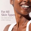 Smiling model with epionce Daily Shield for all skin types text