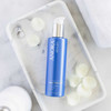 Anora Gel Cleanser bottle in a clear tray with cotton rounds