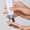 Hands squeezing Calm Water Gel from the tube
