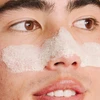 Man wearing white foaming mask across his nose