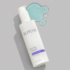 Glytone Mild Gel Cleanser bottle beside a puddle of clear blue gel