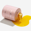 HydroPeptide Moisture Reset bottle on its side spilling golden facial oil