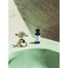 Baxter of California Beard Oil on a mint green sink