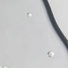 Obagi Professional-C Serum drops on glass texture close-up