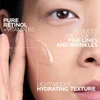 Woman applying serum to cheek, pure retinol + vitamin B3 lightweight texture text