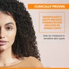 Woman with curly hair, clinically proven to help prevent visible-light pigmentation text