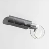 Cosmedix Crystal Cleanse bottle dispensing white cleanser into a glass dish