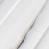 Close-up of glossy white serum swirls