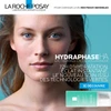 Woman's face beside Hydraphase HA French advertisement text