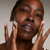 Woman with cleanser lather on her face