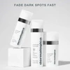 Three Dermalogica PowerBright products on white blocks, fade dark spots fast