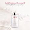 Cleansing oil bottle on silky fabric with product description