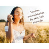 Woman in a wheat field, soothes and moisturizes text