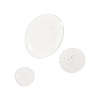 Clear oil droplets on a white surface