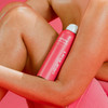 Bacne Spray can held against an arm