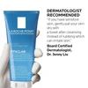 Gloved hand holding Effaclar gel, dermatologist tip to pat skin dry