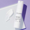 Replenix Age Restore pump bottle with a cream swatch on lavender