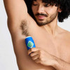 Man applying the Pit Boss stick to his underarm