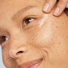 Model applying Dermalogica Phyto Nature Lifting Eye Cream near eye