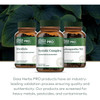 Three Gaia Herbs PRO amber bottles in front of large green leaves