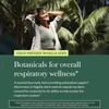 Woman in a tropical forest, cold-pressed nigella seed botanicals graphic