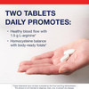 Hand holding two tablets, two tablets daily graphic