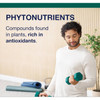 Man exercising with dumbbells beside phytonutrients text