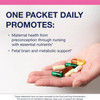 Hand holding assorted capsules with one packet daily text