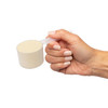 Hand holding a scoop of protein powder