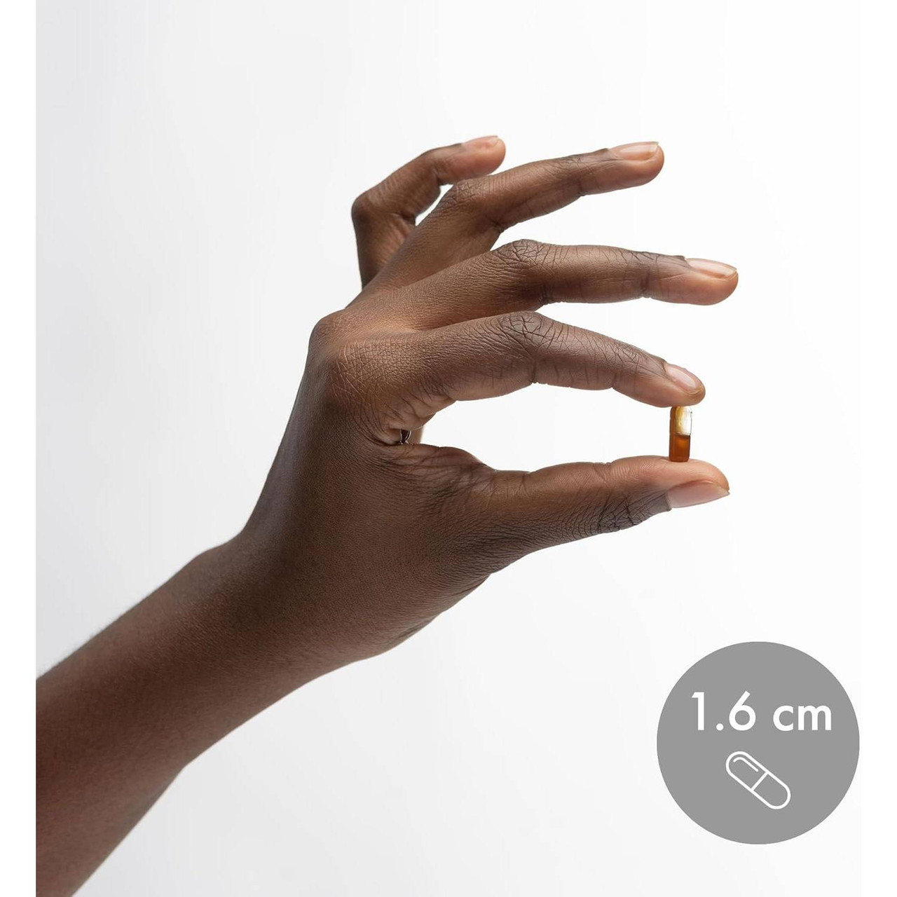 Hand holding a Liposomal Vitamin D3 softgel shown at 1.6 cm for size reference