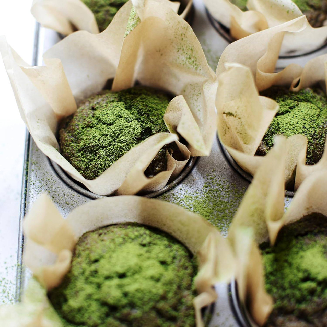 Green matcha muffins in paper liners