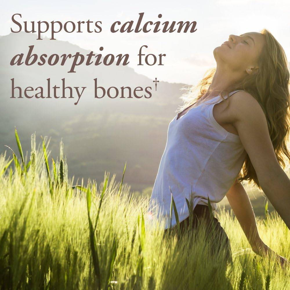 Woman enjoying the sun in a grassy field, mykind Organics vitamin D3 graphic